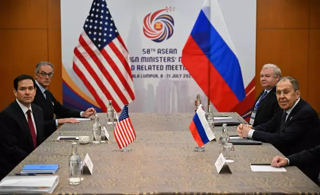 US Secretary of State Marco Rubio, left, meets with Russia's Foreign Minister Sergei Lavrov, right, on the sidelines of the ASEAN Foreign Ministers' meeting in Kuala Lumpur, Thursday, July 10, 2025. (Mandel Ngan/Pool Photo via AP)