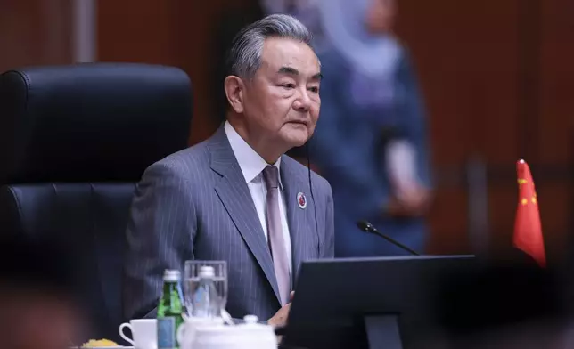 Chinese Foreign Minister Wang Yi attends ASEAN Post-Ministerial Conference with China at the Kuala Lumpur Convention Centrein Kuala Lumpur, Malaysia, Thursday, July 10, 2025. (Hasnoor Hussain/Pool Photo via AP)