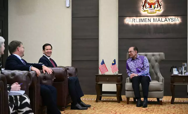 U.S. Secretary of State Marco Rubio, second left, meets with Malaysia's Prime Minister Anwar Ibrahim, right, at the prime minister's office at Parliament as the Association of Southeast Asian Nations (ASEAN) Foreign Ministers' Meeting takes place in Kuala Lumpur Thursday, July 10, 2025. (Mandel Ngan/Pool Photo via AP)