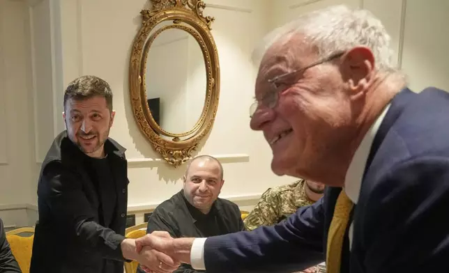 Ukraine President Volodymyr Zelenskyy, left, shakes hands with United States Special Envoy for Ukraine and Russia, Joseph Keith Kellogg, during their meeting in Rome, Italy, Wednesday, July 9, 2025. (AP Photo/Gregorio Borgia)