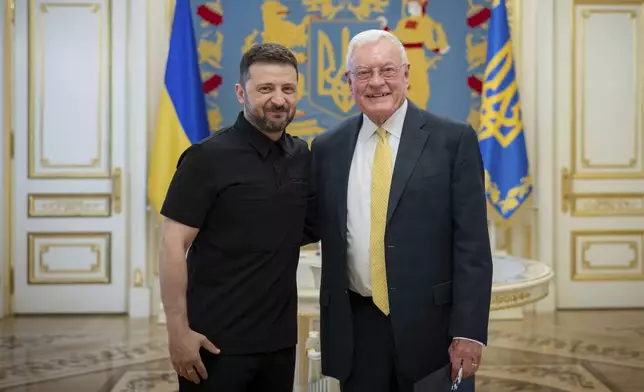 Ukrainian President Volodymyr Zelenskyy, left, and United States Special Envoy for Ukraine and Russia, Joseph Keith Kellogg pose for a photo in Kyiv, Ukraine, Monday, July 14, 2025. (Ukrainian Presidential Press Office via AP)