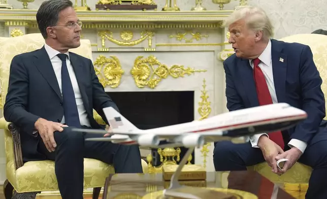 President Donald Trump, right, meets with NATO Secretary General Mark Rutte in the Oval Office of the White House, Monday, July 14, 2025, in Washington. (AP Photo/Evan Vucci)