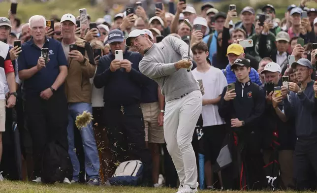 Rory McIlroy of Northern Ireland plays out of the rough on the 4th hole during the first round of the British Open golf championship at the Royal Portrush Golf Club, Northern Ireland, Thursday, July 17, 2025. (AP Photo/Peter Morrison)