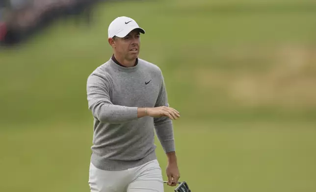 Rory McIlroy of Northern Ireland gestures as he walks on the 1st green during the first round of the British Open golf championship at the Royal Portrush Golf Club, Northern Ireland, Thursday, July 17, 2025. (AP Photo/Peter Morrison)