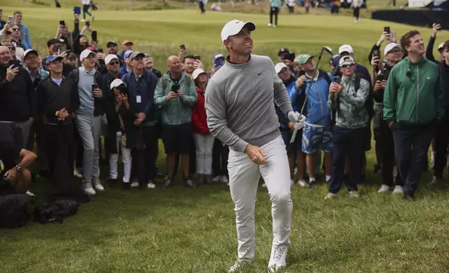 Rory McIlroy of Northern Ireland watches the fight of the ball after he chiped out of the rough on the 2nd hole during the first round of the British Open golf championship at the Royal Portrush Golf Club, Northern Ireland, Thursday, July 17, 2025. (AP Photo/Peter Morrison)