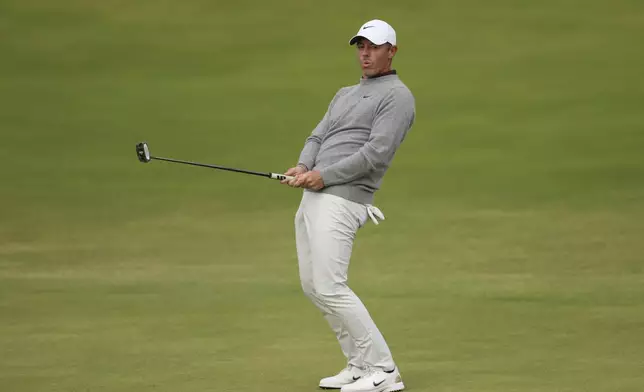 Rory McIlroy of Northern Ireland reacts after putting on the 18th green during the first round of the British Open golf championship at the Royal Portrush Golf Club, Northern Ireland, Thursday, July 17, 2025. (AP Photo/Peter Morrison)