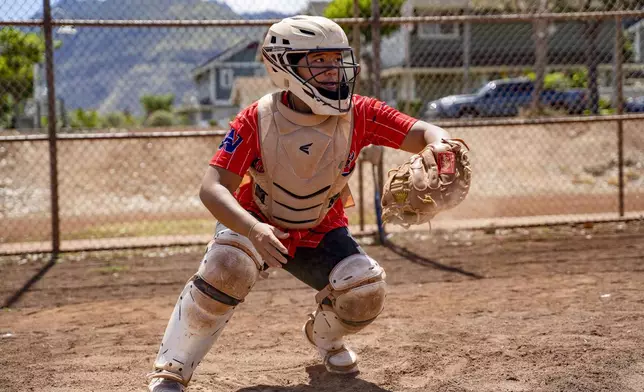 Ry-n Uyeda runs through a catching drill, Friday, July 11, 2025, in Waianae, Hawaii. (AP Photo/Mengshin Lin)