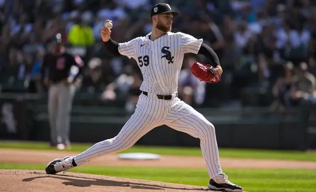 Chicago White Sox starting pitcher Sean Burke (59) throws against the Cleveland Guardians during the first inning of a baseball game Saturday, July 12, 2025, in Chicago. (AP Photo/Erin Hooley)