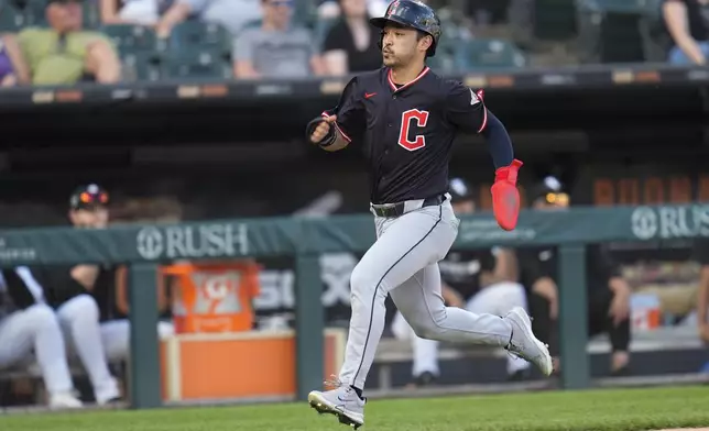 Cleveland Guardians' Steven Kwan runs to score on a single by José Ramírez during the eighth inning of a baseball game against the Chicago White Sox, Saturday, July 12, 2025, in Chicago. (AP Photo/Erin Hooley)