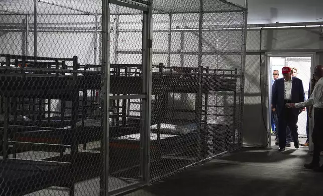 President Donald Trump tours "Alligator Alcatraz," a new migrant detention facility at Dade-Collier Training and Transition facility, Tuesday, July 1, 2025, in Ochopee, Fla. (AP Photo/Evan Vucci)