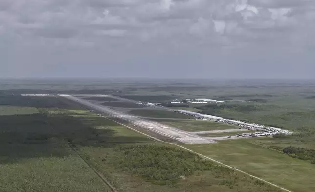This aerial photo shows that the state is plowing ahead with building a an immigration detention facility with heavy-duty tents, trailers and other temporary buildings at the Miami Dade County-owned airfield in the Big Cypress National Preserve, about 45 miles (72 kilometers) west of downtown Miami, This Friday, June 27, 2025. (AP Photo/Daniel Kozin)
