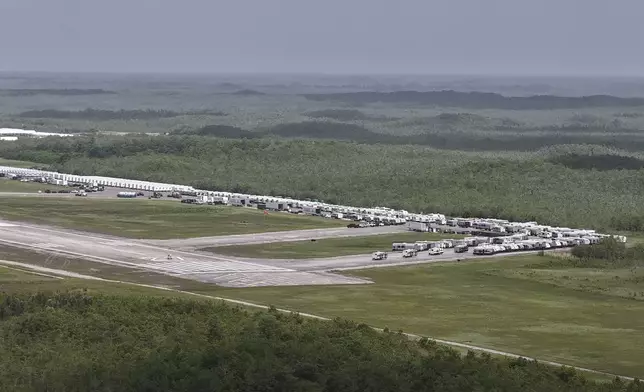 This aerial photo shows that the state is plowing ahead with building a an immigration detention facility with heavy-duty tents, trailers and other temporary buildings at the Miami Dade County-owned airfield in the Big Cypress National Preserve, about 45 miles (72 kilometers) west of downtown Miami, This Friday, June 27, 2025. (AP Photo/Daniel Kozin)