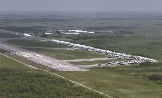FILE - This aerial photo shows heavy-duty tents, trailers and other temporary buildings being built by the state for an immigration detention facility at the Miami Dade County-owned airfield in the Big Cypress National Preserve, about 45 miles west of downtown Miami, June 27, 2025. (AP Photo/Daniel Kozin, File)