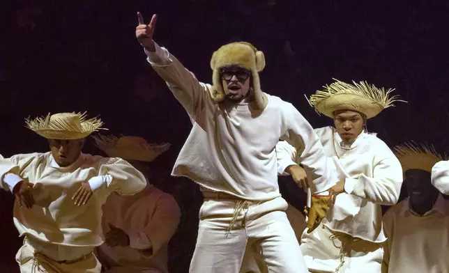 Bad Bunny performs during his first show of his 30-date concert residency at the Coliseo de Puerto Rico José Miguel Agrelot, in San Juan, Puerto Rico, Friday, July 11, 2025. (AP Photo/Alejandro Granadillo)