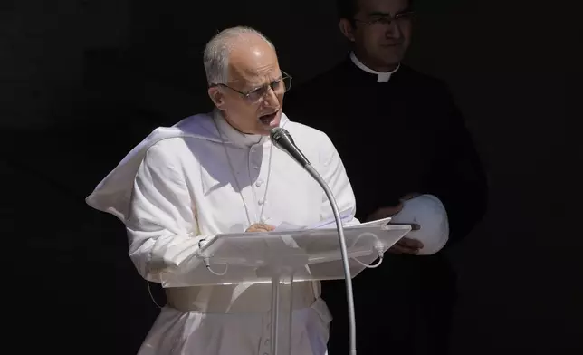 Pope Leo XIV blesses the faithful gathered in the square in front of the Apostolic Palace for the noon Angelus prayer in Castel Gandolfo, Italy, Sunday, July 20, 2025. (AP Photo/Gregorio Borgia)