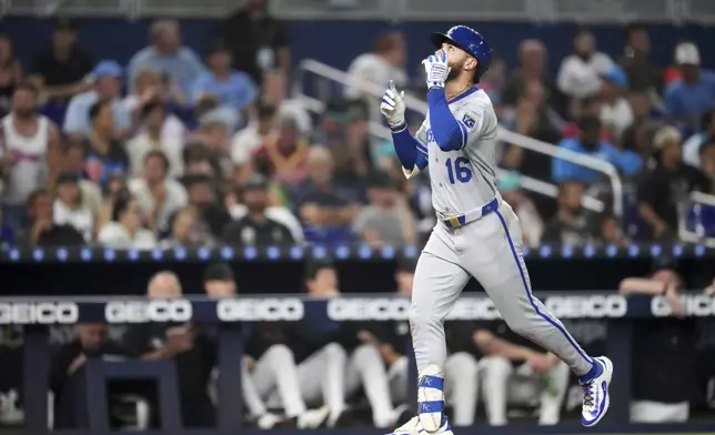 Kansas City Royals John Rave celebrates as he runs home after hitting a three-run home run in the fourth inning of a baseball game against the Miami Marlins, Friday, July 18, 2025, in Miami. (AP Photo/Rebecca Blackwell)