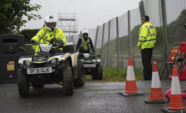 Police on buggies guard the Trump Turnberry golf course in Turnberry, Scotland, Friday, July 25, 2025, ahead of President Trump's visit Scotland. (AP Photo/Alastair Grant)