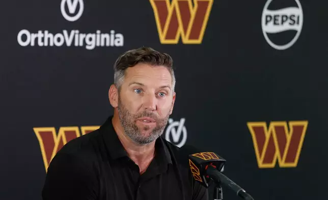 Washington Commanders general manager Adam Peters speaks during a news conference at the NFL football team's training camp in Ashburn, Va., Tuesday, July 22, 2025. (AP Photo/Luis M. Alvarez)