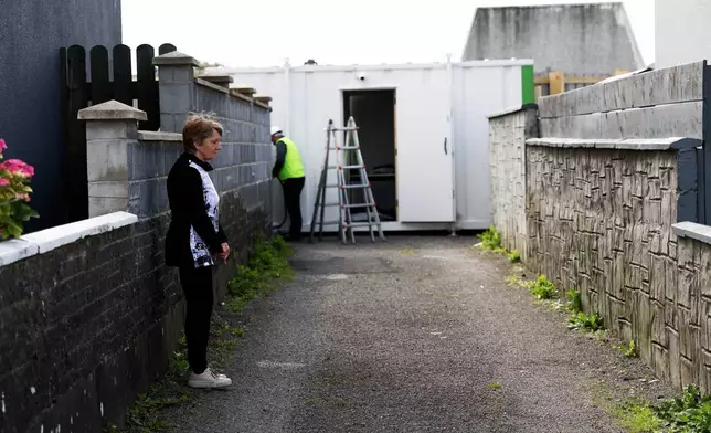 Historian Catherine Corless visits the excavation site of St Mary's home for unmarried mothers and their children, in Tuam, Ireland, July 7, 2025. (AP Photo/Peter Morrison)