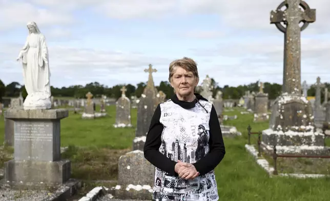 Historian Catherine Corless poses for a photo at Tuam cemetery, Ireland, in Tuam, Ireland, July 7, 2025. (AP Photo/Peter Morrison)