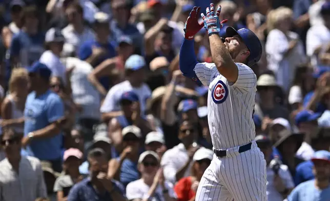 Chicago Cubs' Michael Busch celebrates at home plate after hitting a solo home run during the second inning of a baseball game against the St. Louis Cardinals, Saturday, July 5, 2025, in Chicago. (AP Photo/Paul Beaty)