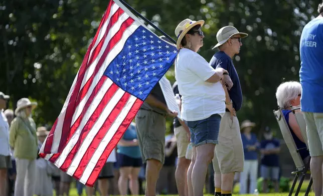 Theresa Peiffer, of Polk City, Iowa, listens to a speaker during an Iowa Democratic Party rally, Thursday, July 3, 2025, in Windsor Heights, Iowa. (AP Photo/Charlie Neibergall)