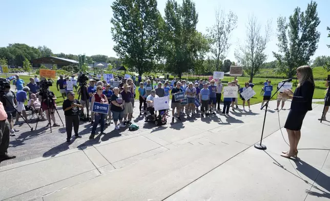 Iowa congressional candidate Sarah Trone Garriott speaks during an Iowa Democratic Party rally, Thursday, July 3, 2025, in Windsor Heights, Iowa. (AP Photo/Charlie Neibergall)