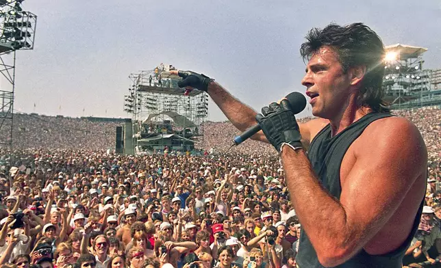 FILE - Rick Springfield performs at Live Aid, a famine relief concert at JFK Stadium in Philadelphia Pa., Jon uly 13, 1985. (AP Photo/Amy Sancetta, File)