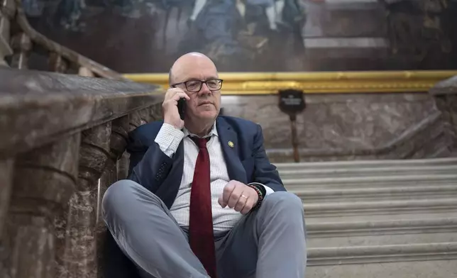 Rep. Jim McGovern, D-Mass., the top Democrat on the House Rules Committee, waits on the marble stairway outside the House chamber before the vote on President Donald Trump's signature bill of tax breaks and spending cuts, at the Capitol in Washington, Thursday, July 3, 2025. (AP Photo/J. Scott Applewhite)