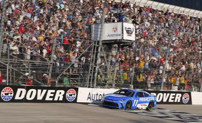 Denny Hamlin crosses the finish line to win a NASCAR Cup Series auto race at Dover Motor Speedway, Sunday, July 20, 2025, in Dover, Del. (AP Photo/Derik Hamilton)