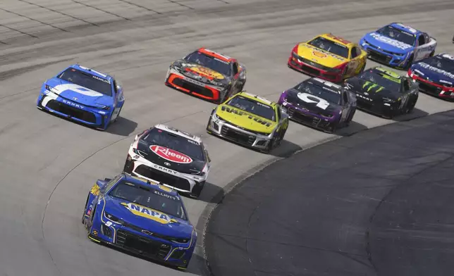 Chase Elliott leads the field on a restart during a NASCAR Cup Series auto race at Dover Motor Speedway, Sunday, July 20, 2025, in Dover, Del. (AP Photo/Derik Hamilton)