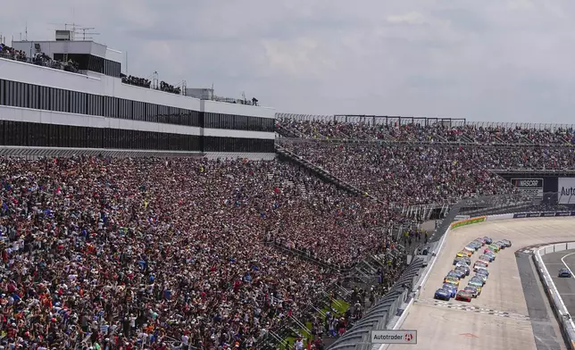Chase Elliott (9) and Chase Briscoe (19) lead the field to the green flag during a NASCAR Cup Series auto race at Dover Motor Speedway, Sunday, July 20, 2025, in Dover, Del. (AP Photo/Derik Hamilton)