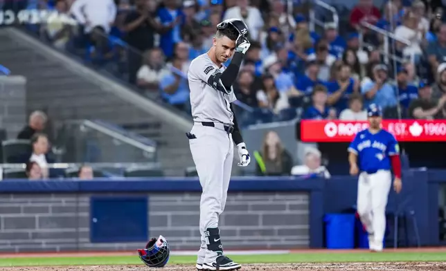 New York Yankees' Cody Bellinger reacts after striking out against the Toronto Blue Jays during eighth-inning baseball game action in Toronto, Thursday, July 3, 2025. (Thomas Skrlj/The Canadian Press via AP)