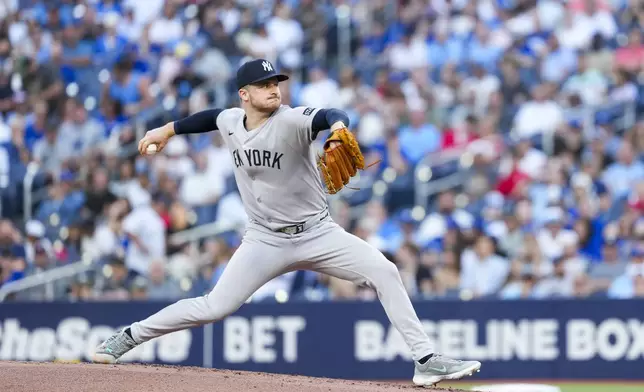 New York Yankees pitcher Clarke Schmidt throws against the Toronto Blue Jays during first-inning baseball game action in Toronto, Thursday, July 3, 2025. (Thomas Skrlj/The Canadian Press via AP)