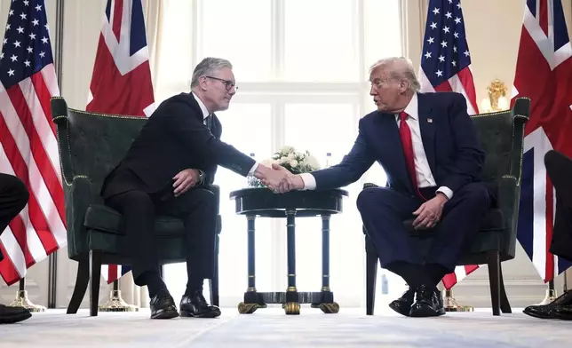 President Donald Trump, right, shakes hands with Britain's Prime Minister Keir Starmer during a meeting at the Trump Turnberry golf course in Turnberry, Scotland Monday, July 28, 2025. (AP Photo/Jacquelyn Martin)
