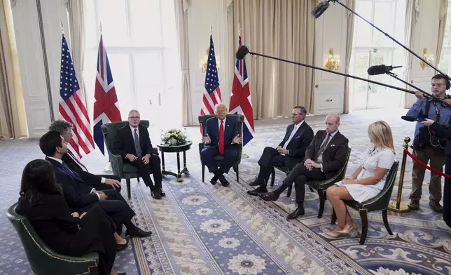 President Donald Trump, center, and Britain's Prime Minister Keir Starmer, center-left, speak with the media during a meeting at the Trump Turnberry golf course in Turnberry, Scotland Monday, July 28, 2025. (AP Photo/Jacquelyn Martin)