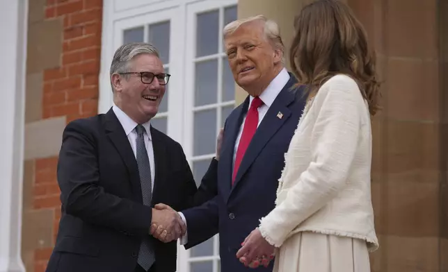 President Donald Trump meets with Britain's Prime Minister Keir Starmer, left, and his wife Victoria Starmer at Trump Turnberry golf club on Monday, July 28, 2025 in Turnberry, Scotland. (Christopher Furlong/Pool Photo via AP)