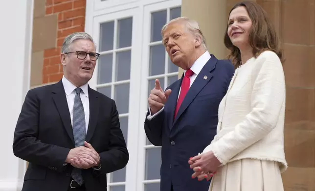 President Donald Trump meets with Britain's Prime Minister Keir Starmer, left, and his wife Victoria Starmer at Trump Turnberry golf club on Monday, July 28, 2025 in Turnberry, Scotland. (Christopher Furlong/Pool Photo via AP)