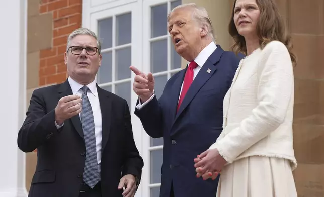 President Donald Trump meets with Britain's Prime Minister Keir Starmer, left, and his wife Victoria Starmer at Trump Turnberry golf club on Monday, July 28, 2025 in Turnberry, Scotland. (Christopher Furlong/Pool Photo via AP)