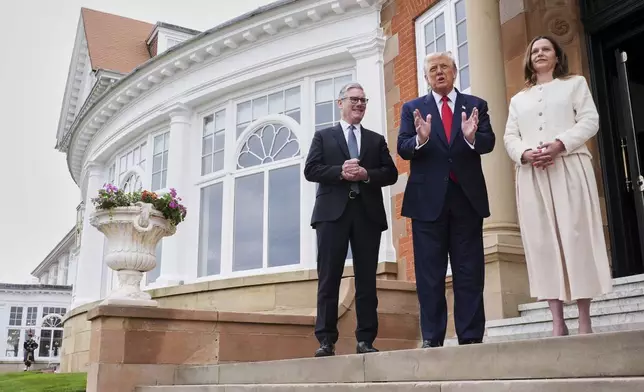 President Donald Trump, center, greets Britain's Prime Minister Keir Starmer, left, and his wife Victoria at the Trump Turnberry golf course in Turnberry, Scotland Monday, July 28, 2025. (AP Photo/Jacquelyn Martin)