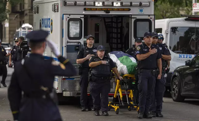A casket of NYPD Officer Didarul Islam arrives at Parkchester Jame Masjid after Monday's deadly shooting, Tuesday, July 29, 2025, in New York. (AP Photo/Yuki Iwamura)