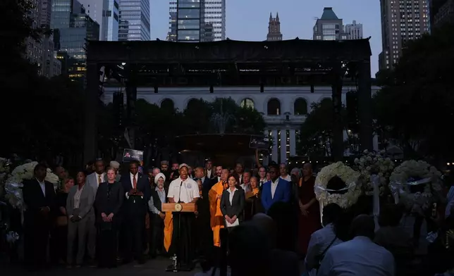 New York Mayor Eric Adams speaks during a vigil for the people killed by a gunman at a Manhattan office building a day prior, Tuesday, July 29, 2025, at Bryant Park in New York. (AP Photo/Angelina Katsanis)