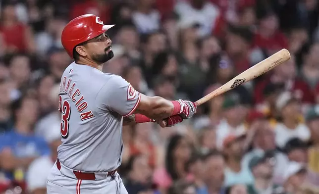 Cincinnati Reds' Christian Encarnacion-Strand watches the flight of his grand slam drive against the Boston Red Sox during the seventh inning of a baseball game at Fenway Park, Wednesday, July 2, 2025, in Boston. (AP Photo/Charles Krupa)