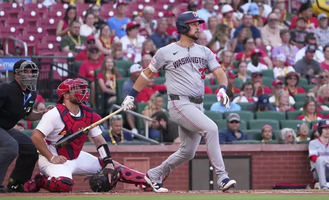 Washington Nationals' Nathaniel Lowe watches his three-run home run during the first inning of a baseball game against the St. Louis Cardinals Wednesday, July 9, 2025, in St. Louis. (AP Photo/Jeff Roberson)