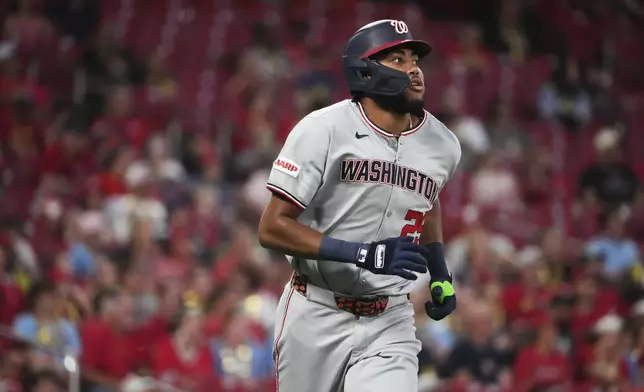 Washington Nationals' James Wood watches his solo home run during the seventh inning of a baseball game against the St. Louis Cardinals Wednesday, July 9, 2025, in St. Louis. (AP Photo/Jeff Roberson)