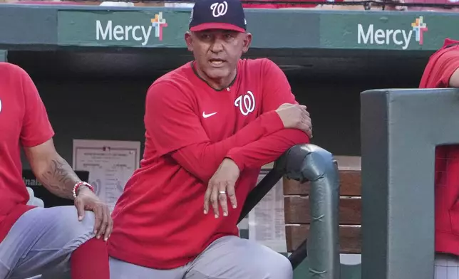 Washington Nationals interim manager Miguel Cairo watches from the dugout during the first inning of a baseball game against the St. Louis Cardinals Wednesday, July 9, 2025, in St. Louis. (AP Photo/Jeff Roberson)