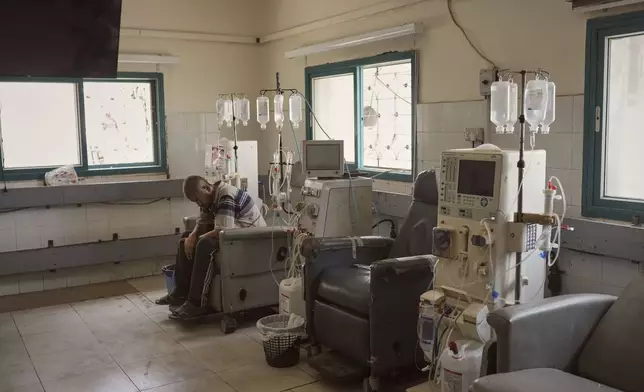 A patient sits in the dialysis unit at Shifa Hospital in Gaza City on Tuesday, July 1, 2025, after the facility suspended its services due to fuel shortages needed to power its generators. (AP Photo/Jehad Alshrafi)
