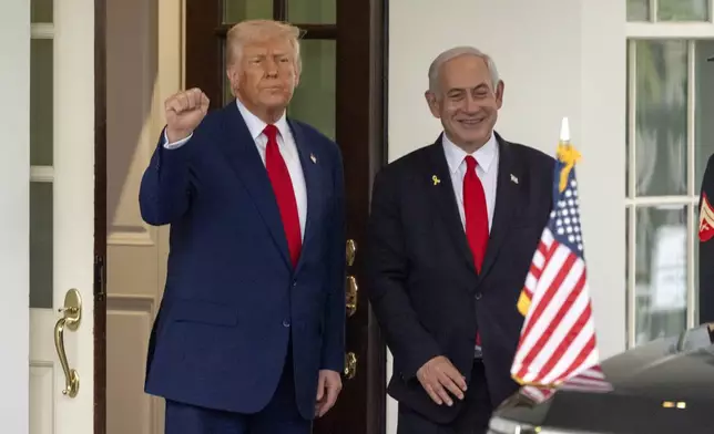 FILE - President Donald Trump, left, stands with Israel's Prime Minister Benjamin Netanyahu at the West Wing of the White House, April 7, 2025, in Washington. (AP Photo/Mark Schiefelbein, File)