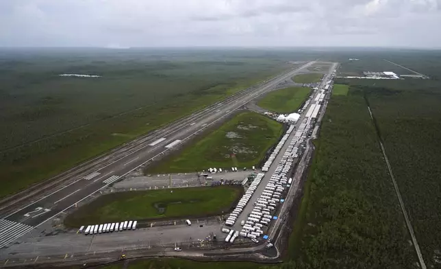 Work progresses on a new migrant detention facility dubbed "Alligator Alcatraz," at Dade-Collier Training and Transition facility in the Florida Everglades, Friday, July 4, 2025, in Ochopee, Fla. (AP Photo/Rebecca Blackwell)