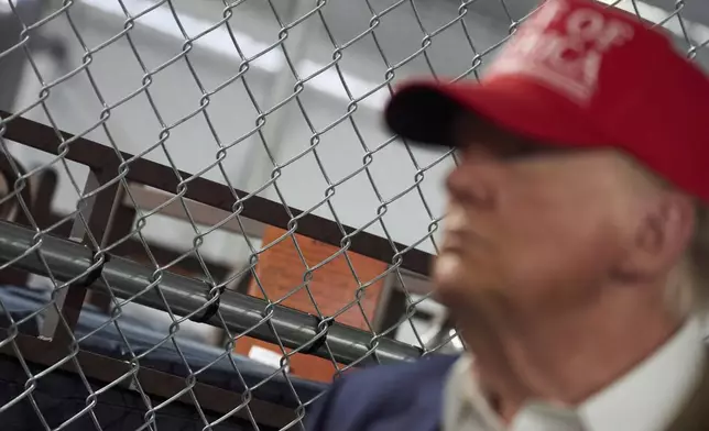 President Donald Trump tours "Alligator Alcatraz," a new migrant detention facility at Dade-Collier Training and Transition facility, Tuesday, July 1, 2025, in Ochopee, Fla. (AP Photo/Evan Vucci)